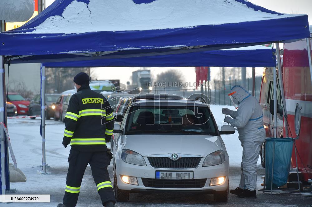 queue of commuters waiting for mandatory coronavirus tests at Czech-German border in Pomezi nad Ohri