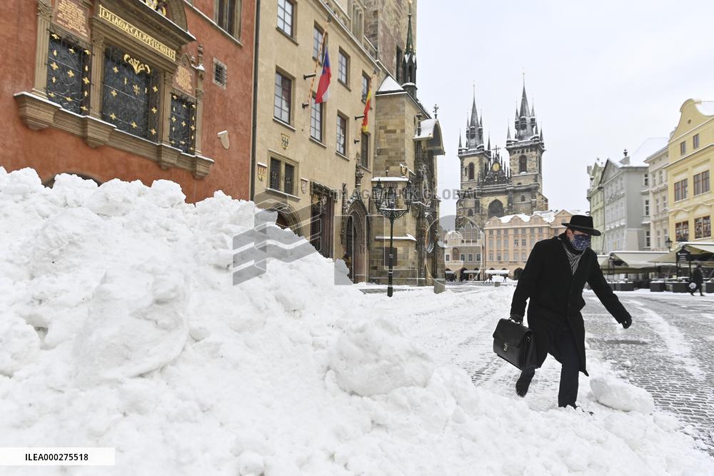 Old Town Square in Prague, snow, man