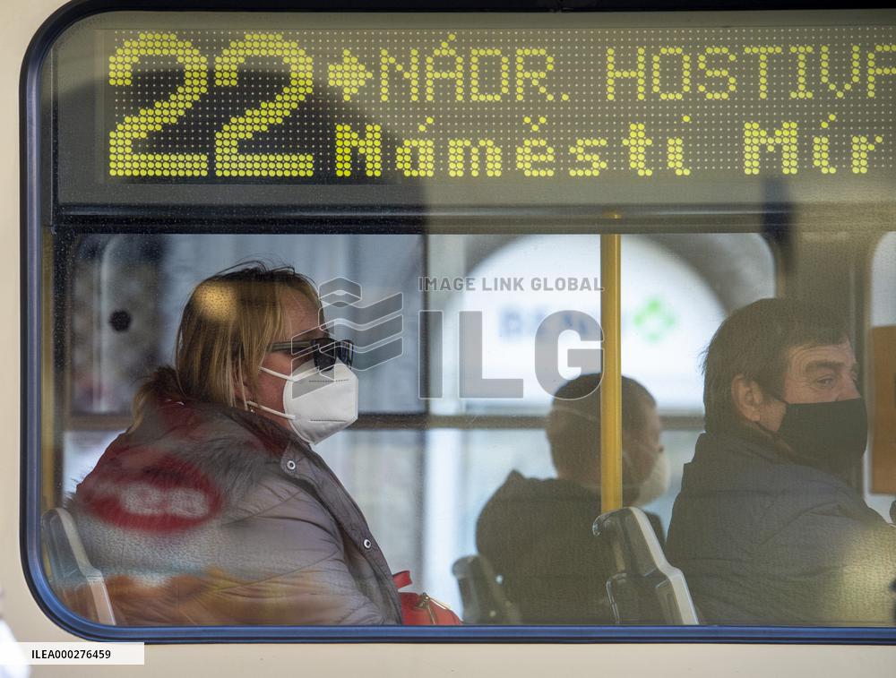 people with respirators in public transport, respirator, face mask, woman, tram