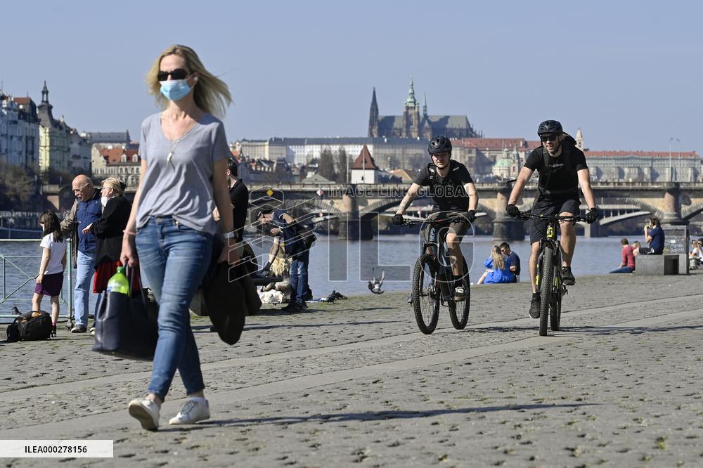 People, River Vltava embankment, Prague, Prague Castle, face mask, cyclist