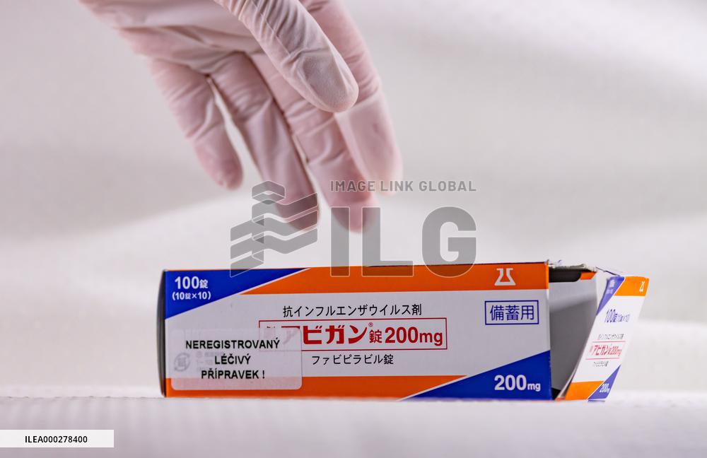 Favipiravir, drugs, box, unregistered drug, hands in gloves.