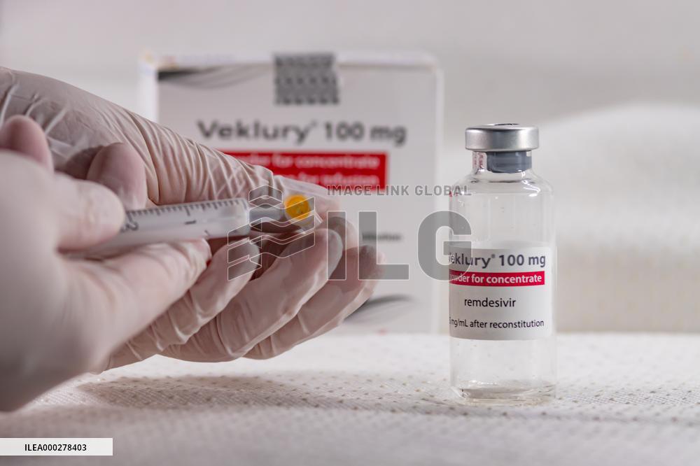 Remdesivir, Veklury, drugs, syringe, hands in gloves.