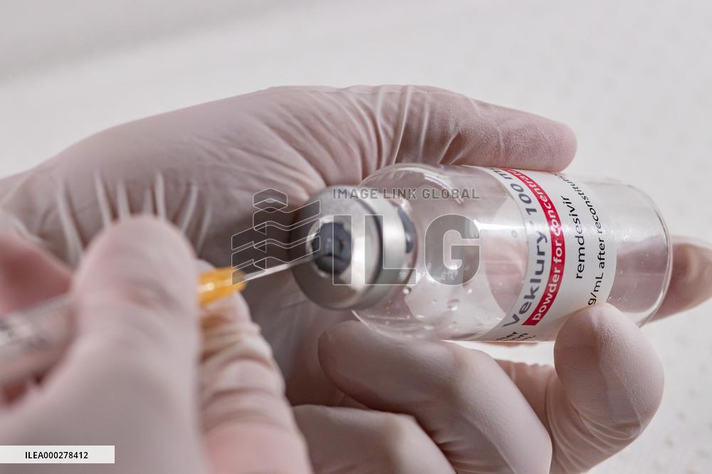 Remdesivir, Veklury, drugs, syringe, hands in gloves.