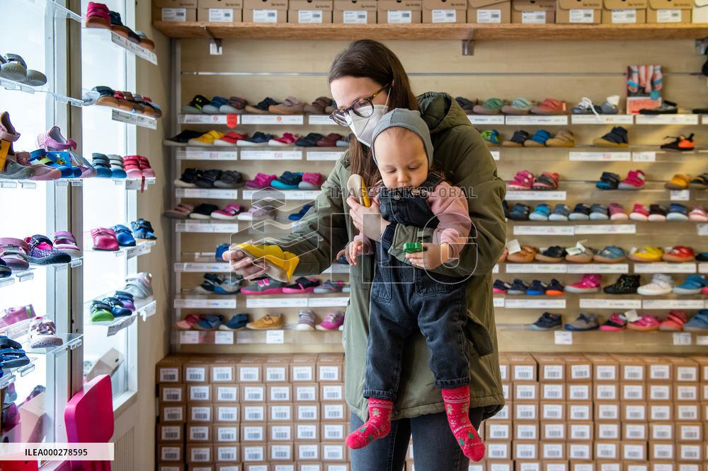 Shops with child clothing and shoes, reopening, shopping