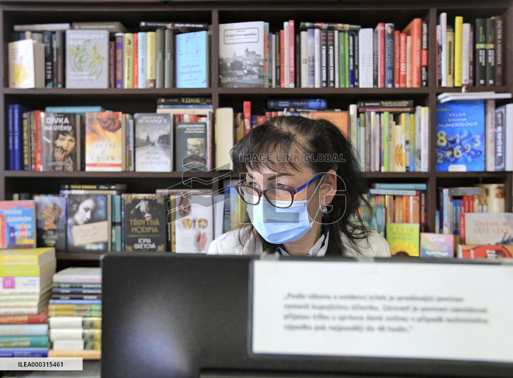 Shop with books, bookshop, customer, sales manager, face mask