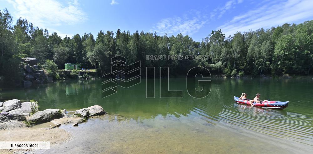 flooded quarry, water, summer, heat, boat
