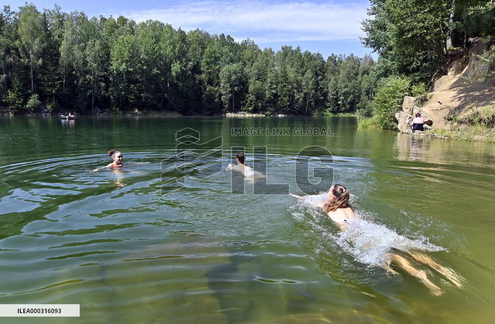 flooded quarry, water, summer, heat, swimming
