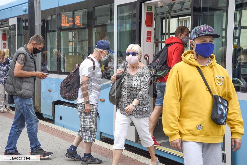 Public transport Ostrava, tram, people, face mask