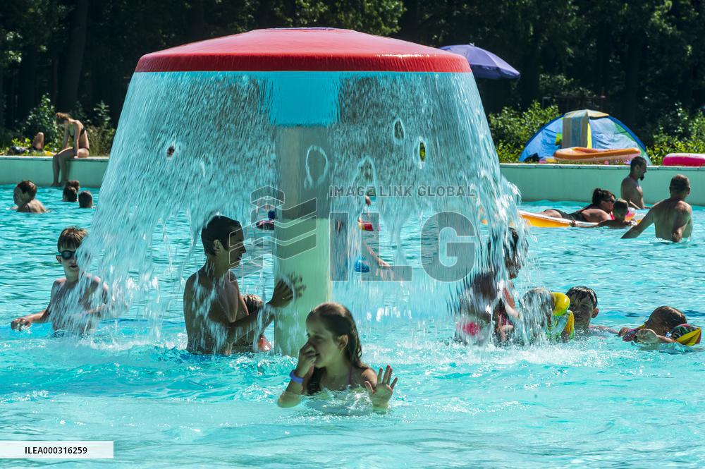 Natural swimming pool in Osek, sunny weather