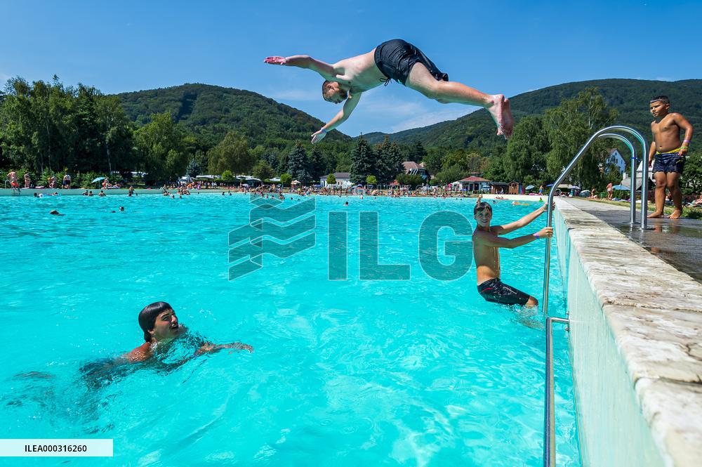 Natural swimming pool in Osek, sunny weather