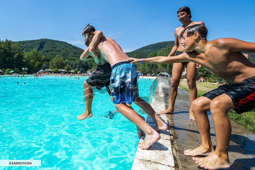 Natural swimming pool in Osek, sunny weather