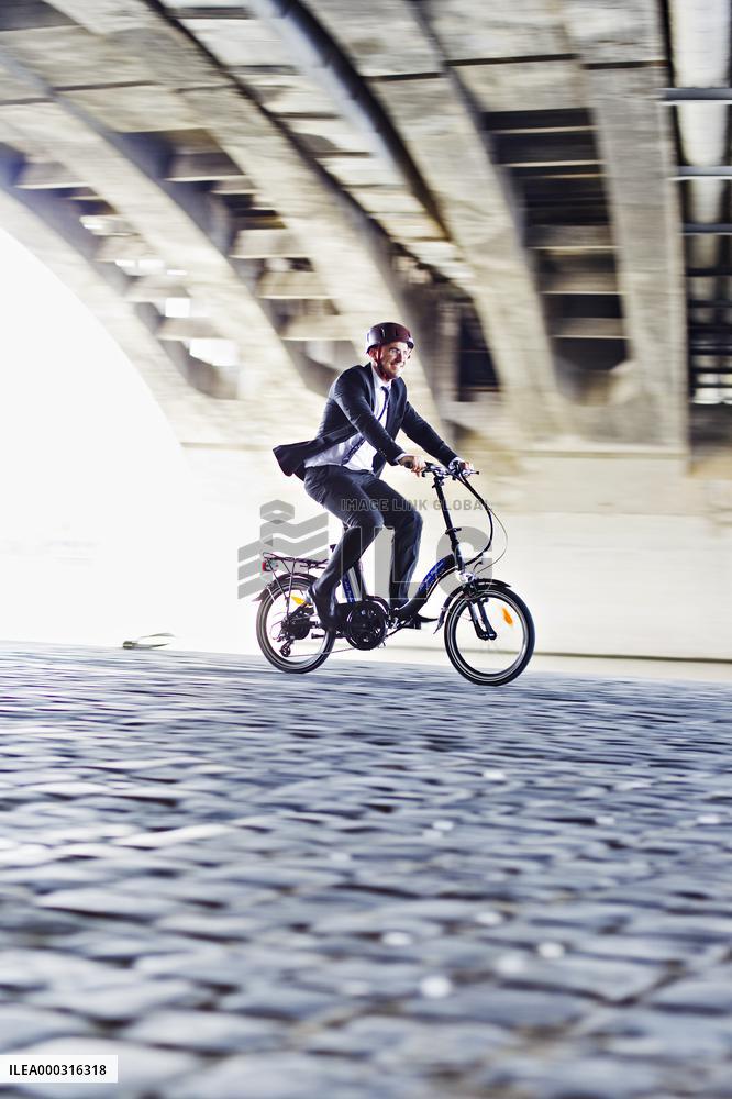 electric bike, electric powered bicycle, e-bike, cyclist, man, suit