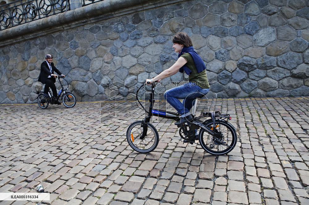 electric bike, electric powered bicycle, e-bike, cyclist, man, suit, woman, cyclists