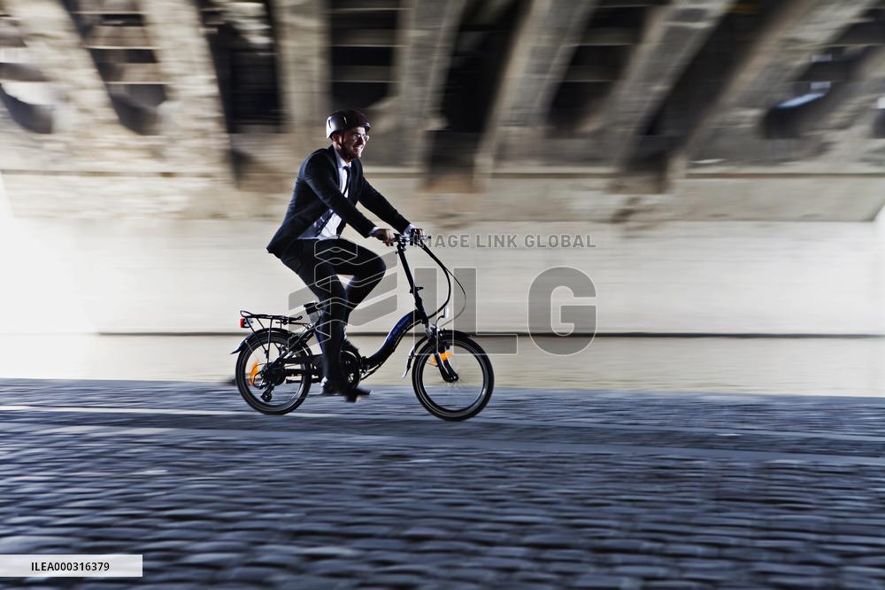 electric bike, electric powered bicycle, e-bike, cyclist, man, suit