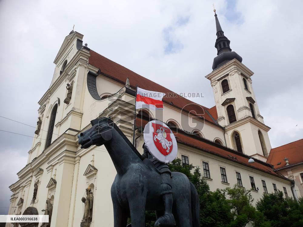 Flag and State Emblem od Belarus on the statue of Moravian Margrave Jost, Brno