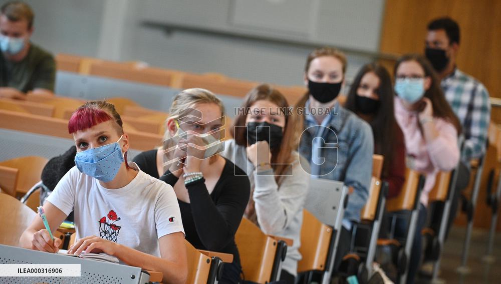 students with protective face masks, mask