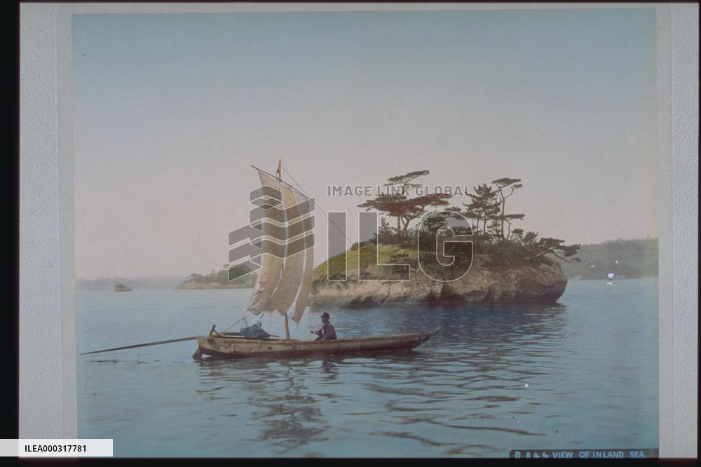 Small island and a sailing boat