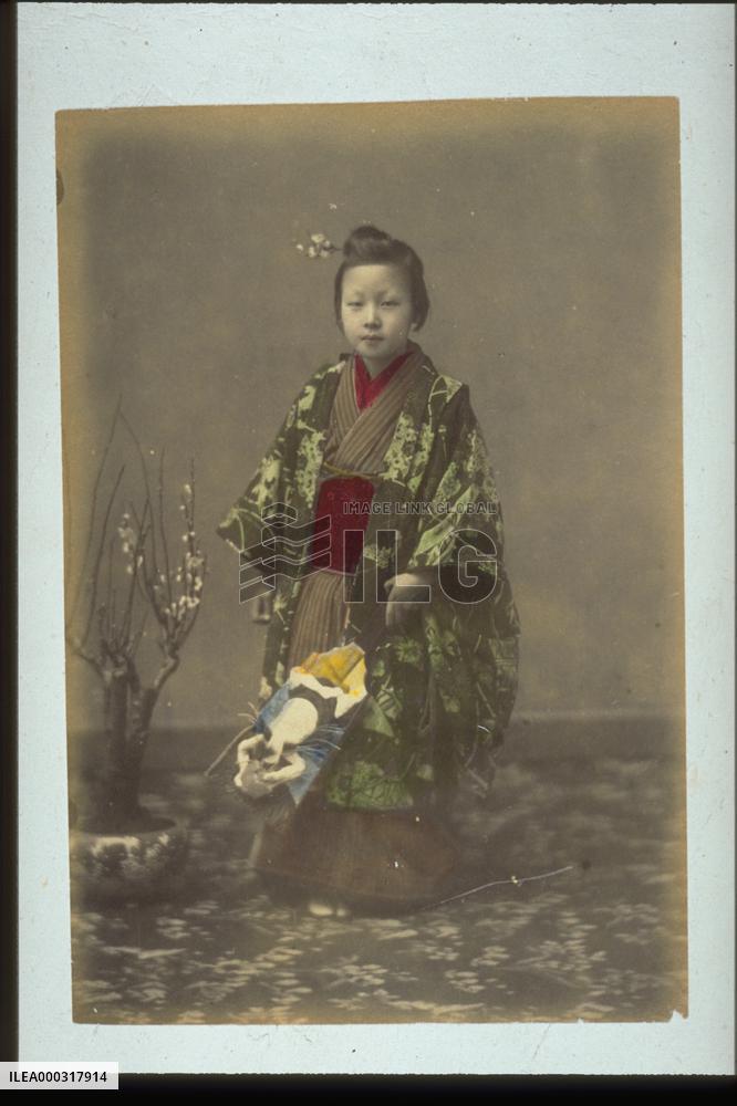 Girl holding hagoita,a battledore