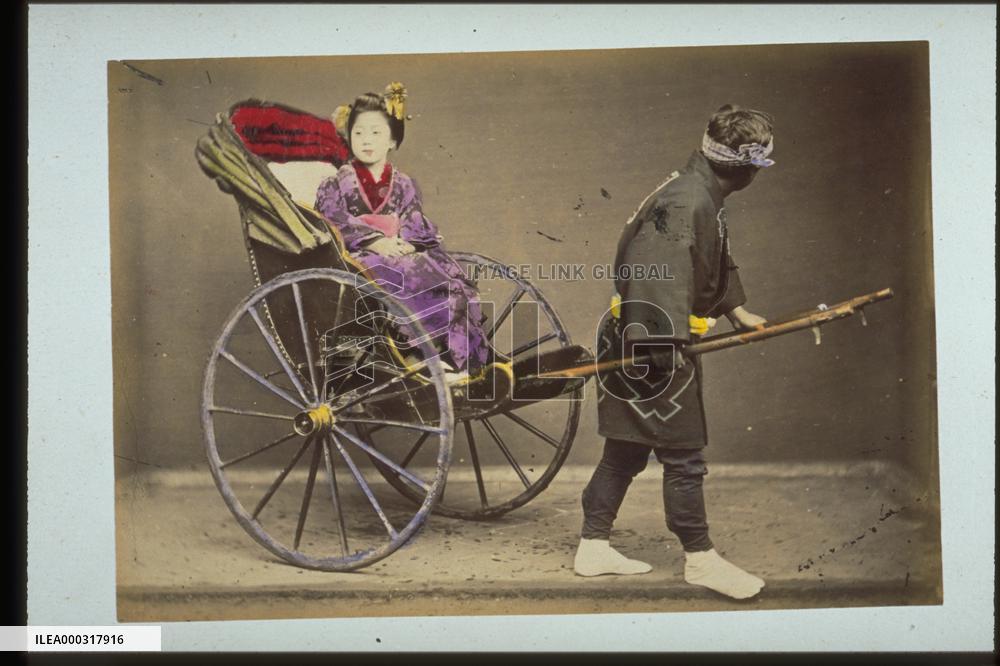 A woman on a jinrikisha