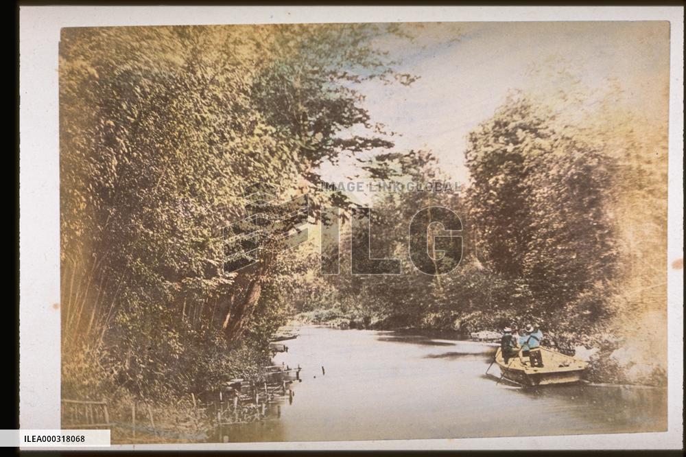 A small boat going down the river