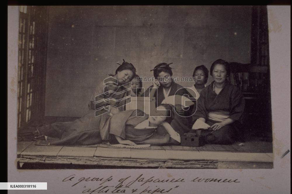Women relaxing with tea and tobacco
