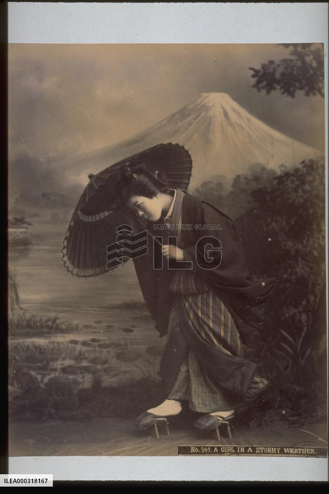 A woman holding an umbrella