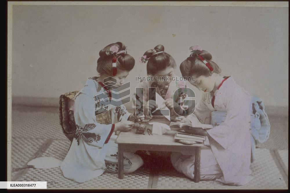 Women folding paper