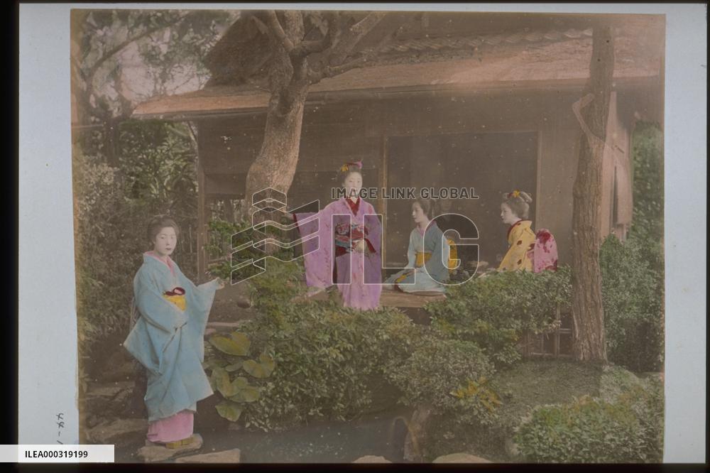 Women on the approach to a garden