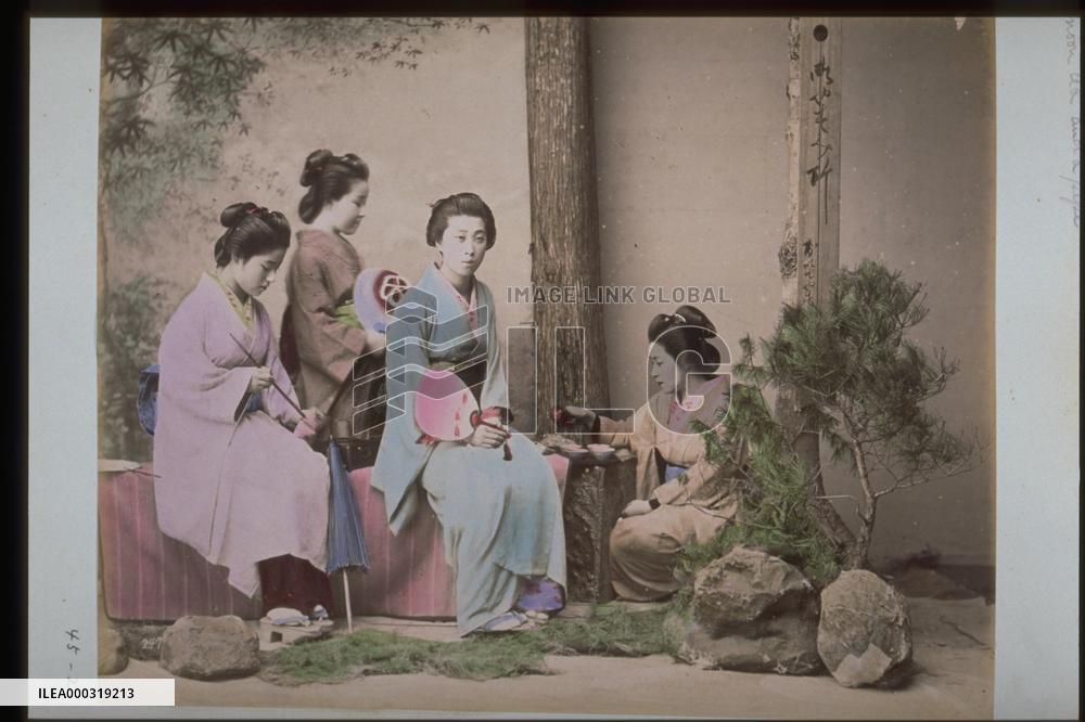 Women relaxing with tea and tobacco