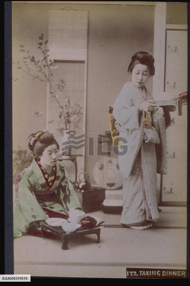 Women carrying dishes