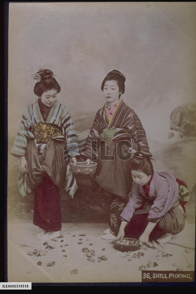 Women picking up shells