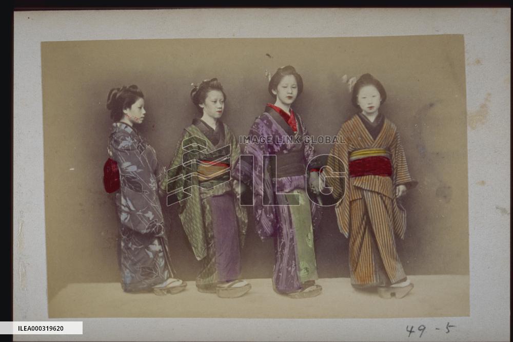 Girls standing hand in hand