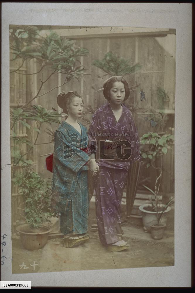 Girls standing hand in hand