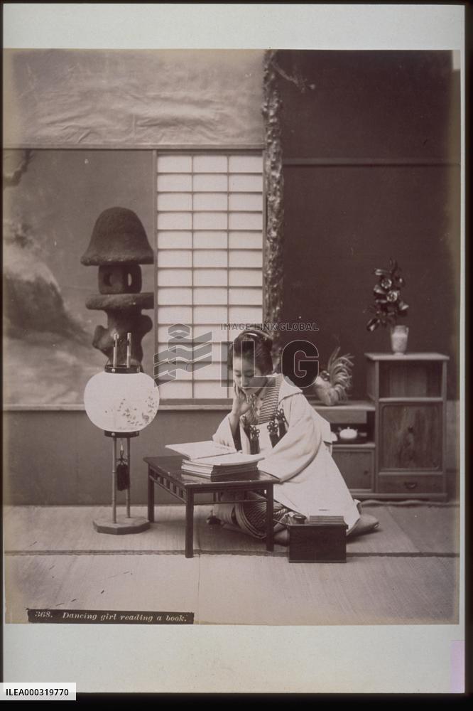 A dancer reading a book