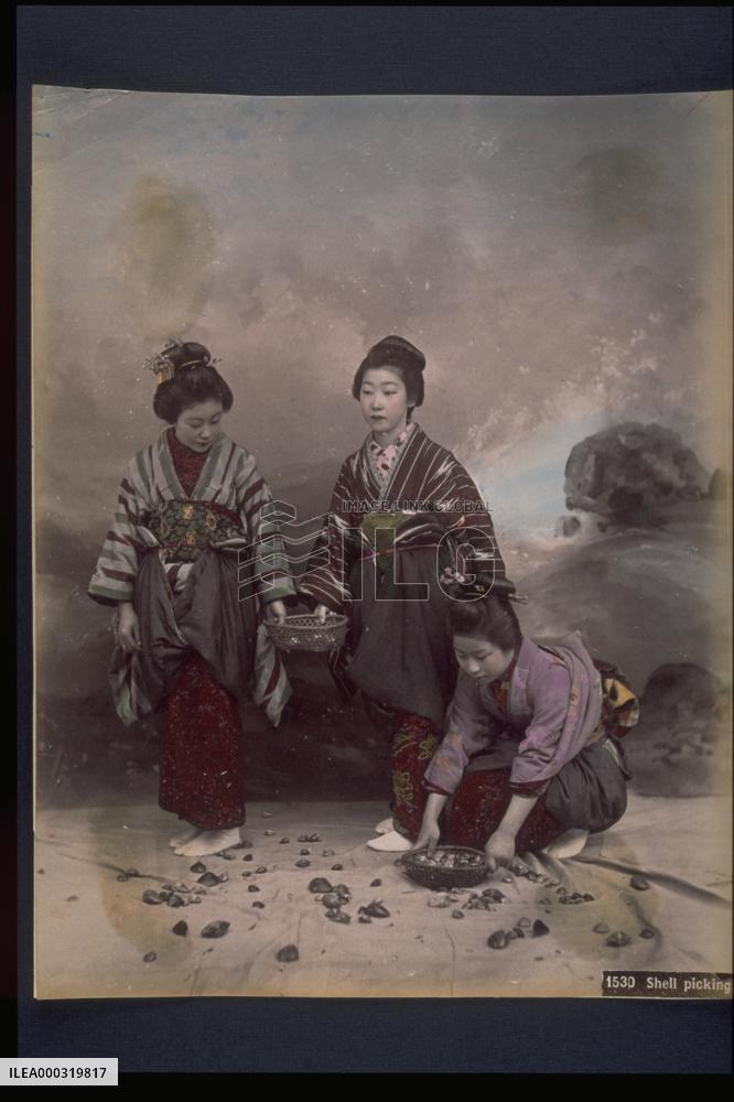 Women picking up shells