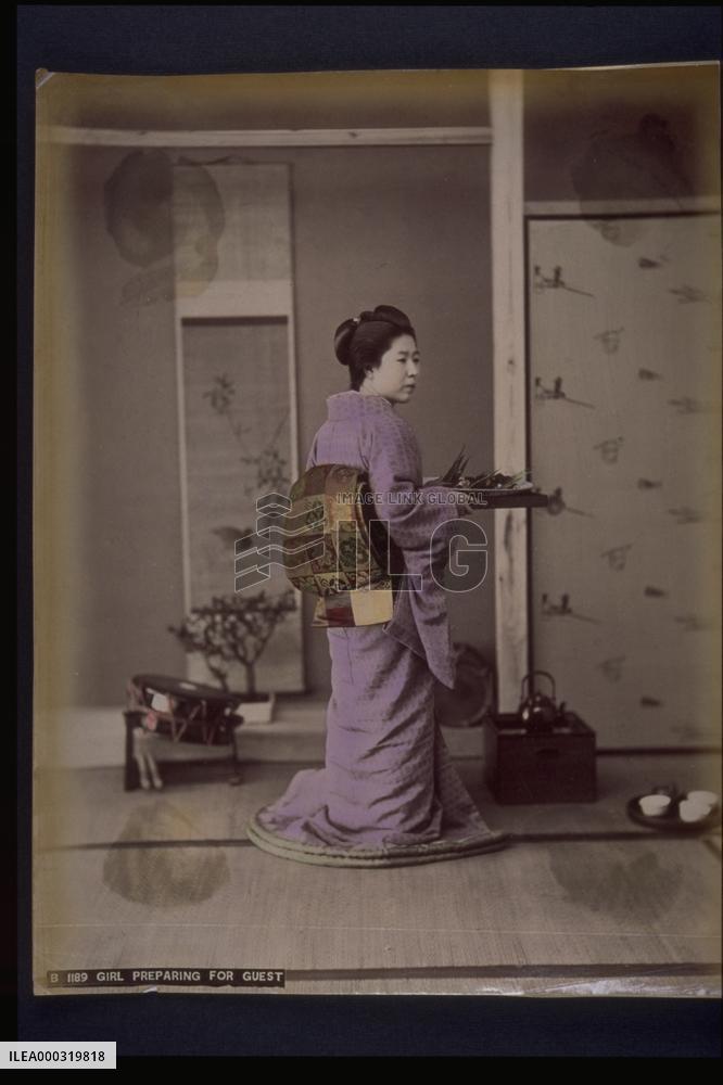 A woman preparing dishes for guests