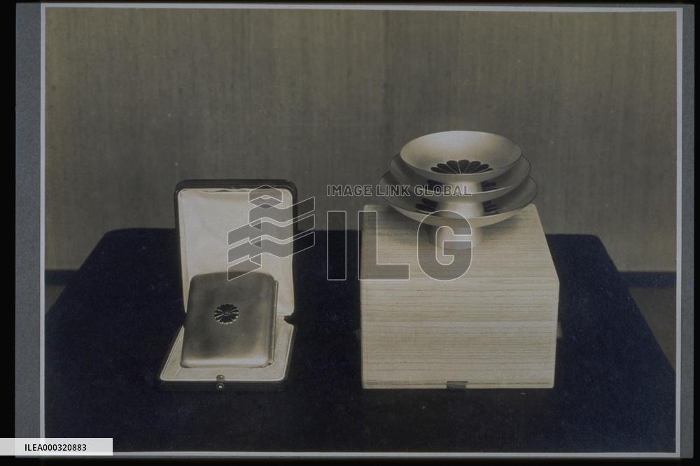 A gold cup and a cigarette case