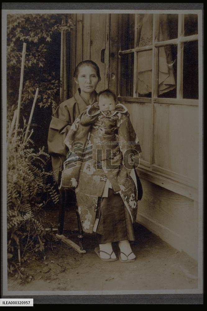A grandmother holding her grandchild