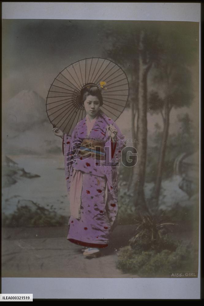A woman holding an umbrella