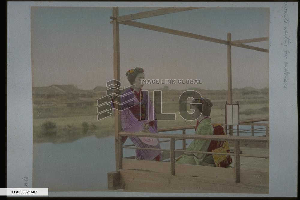 Enjoying a cool evening on yuka platforms along the Kamo River