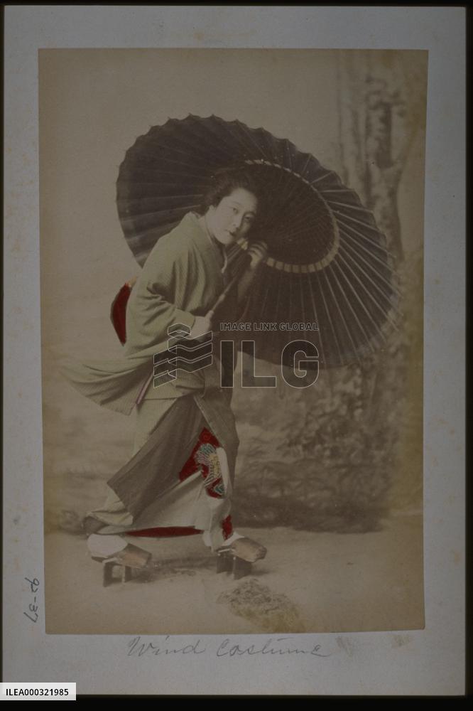A woman holding an umbrella