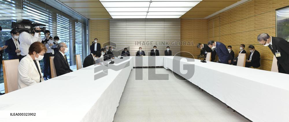 Japan PM Suga apologizes over workers' asbestos diseases