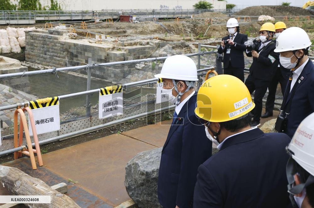 Japan PM Suga visits railway ruins in Tokyo