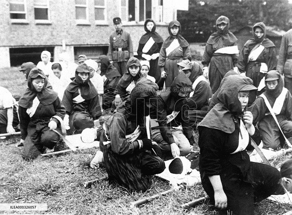 Women participate in air raid drills