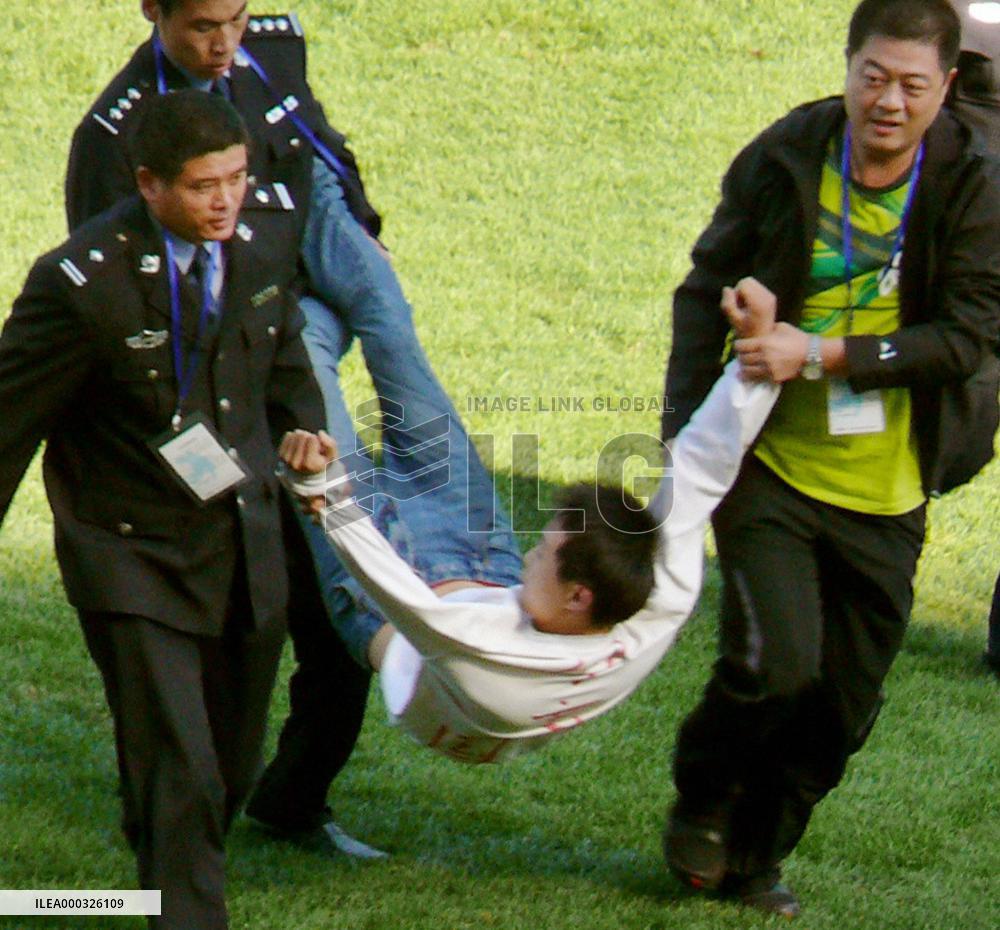 Intruder disrupts Japan soccer match in China