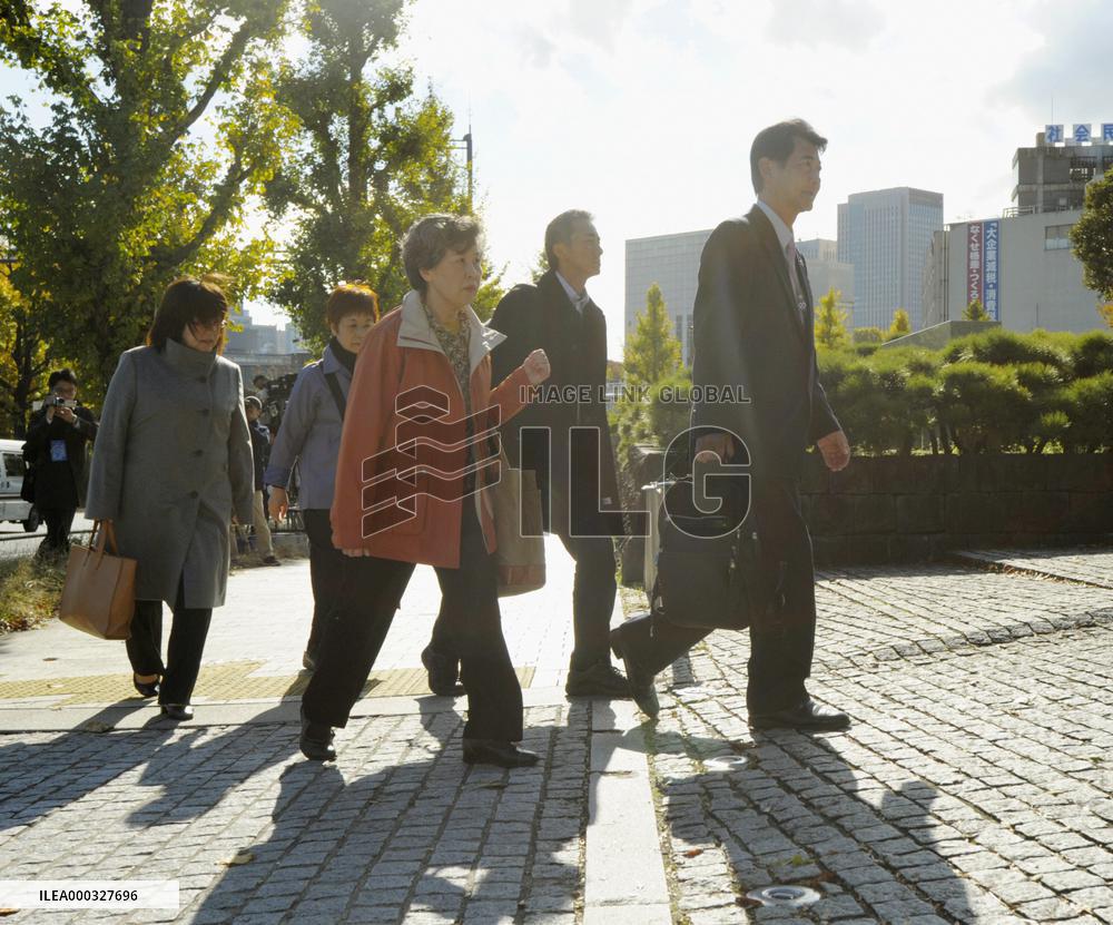 Widow of AUM victim walks into top court