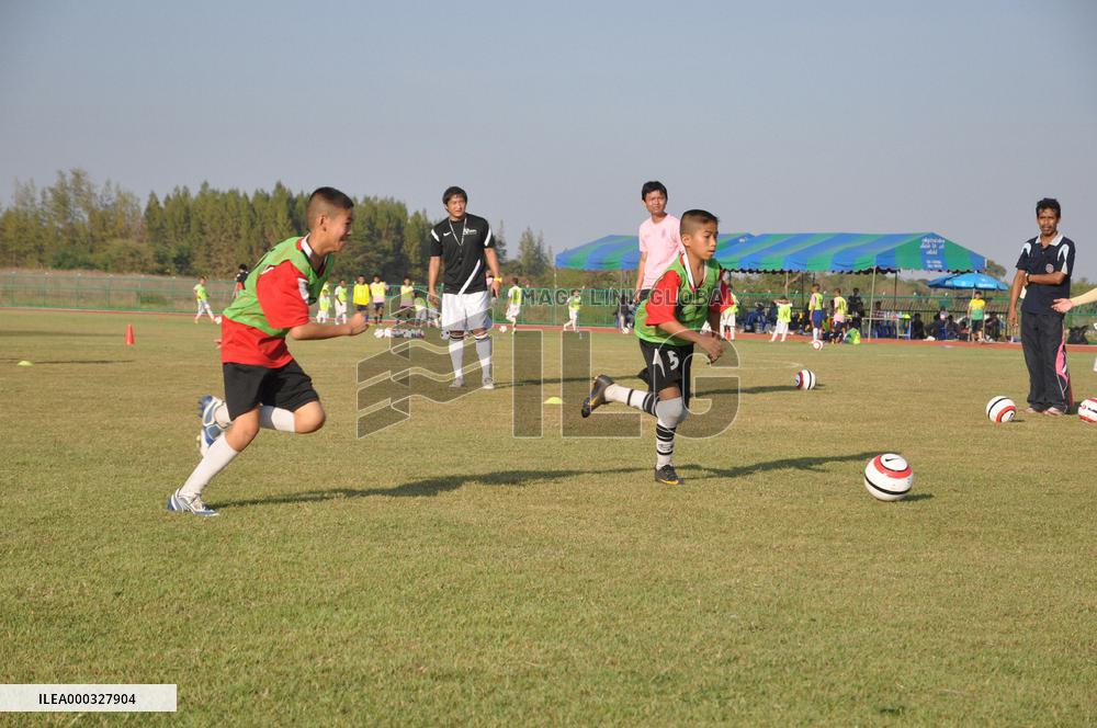 Retired Japanese footballer coaches Thai children