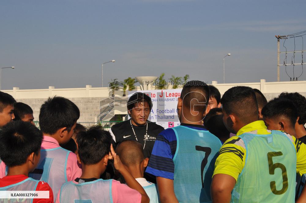 Retired Japanese footballer coaches Thai children