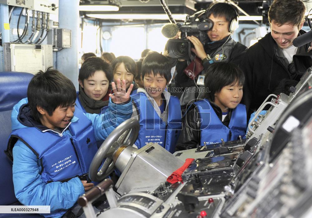 Children invited aboard U.S. rescue ship Safeguard