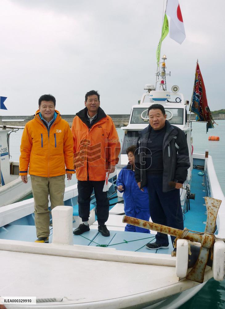 Japan lawmakers survey disputed isles from boat